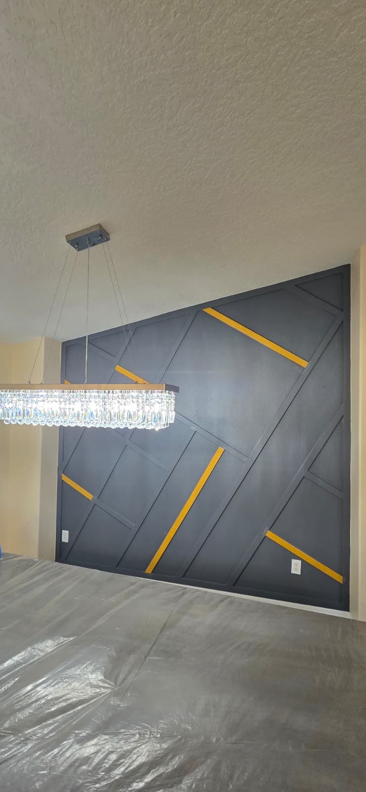Custom geometric accent wall with gold accents